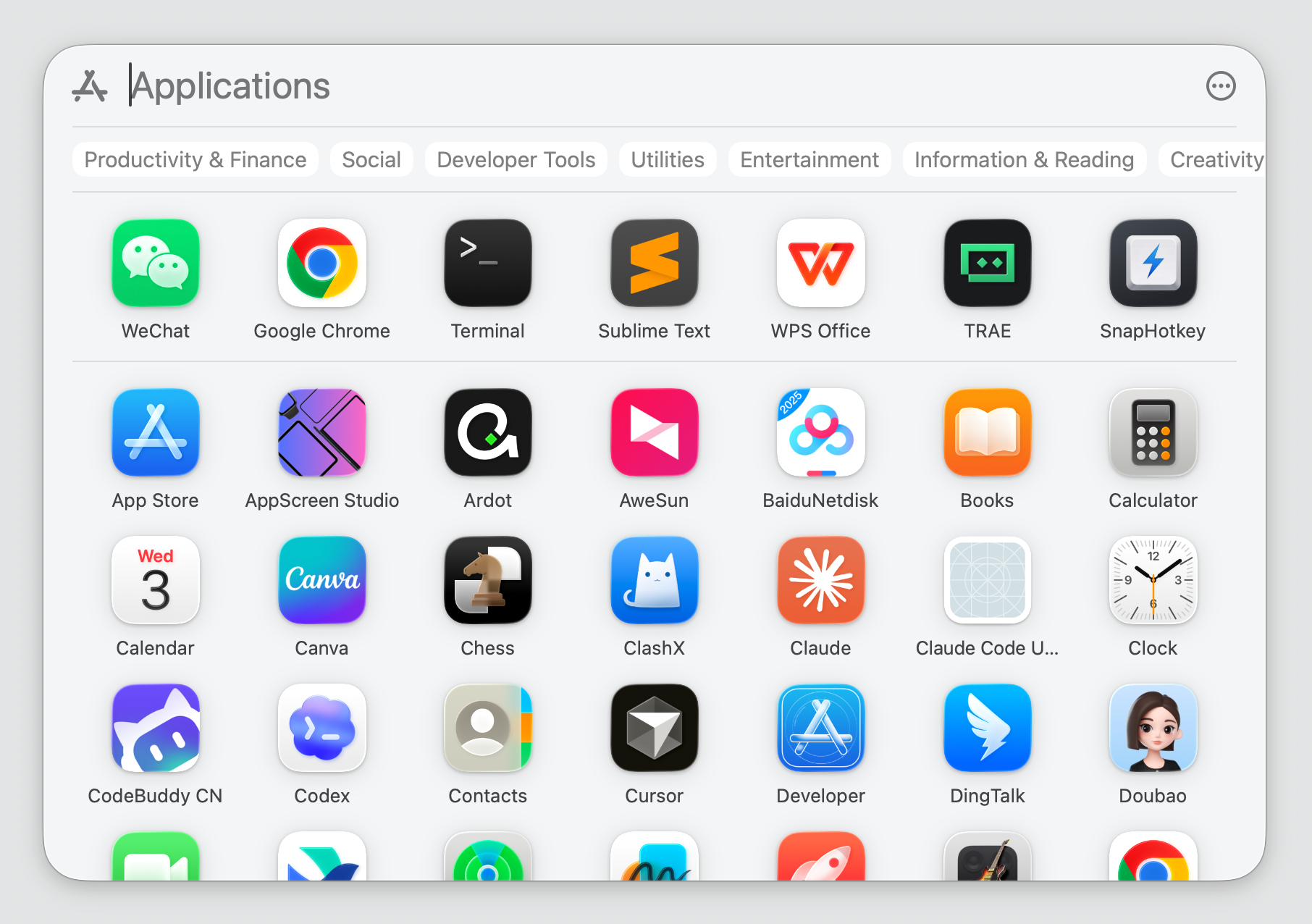 The Spotlight Apps view on macOS Tahoe — categorized app grid that replaces Launchpad